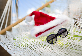 Image showing hammock with santa helper hat and shades