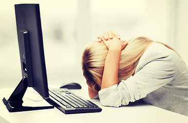 Image showing stressed woman with computer