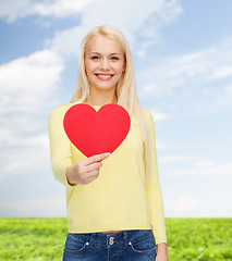 Image showing smiling woman with red heart
