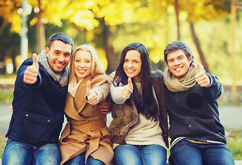 Image showing group of friends having fun in autumn park