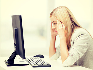 Image showing stressed woman with computer