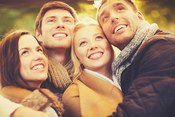 Image showing group of friends having fun in autumn park