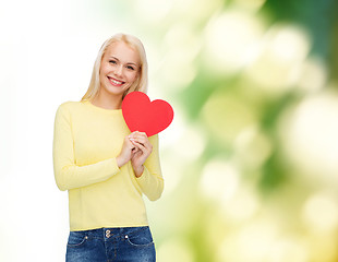 Image showing smiling woman with red heart