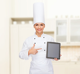 Image showing smiling female chef with tablet pc blank screen