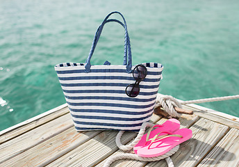 Image showing close up of beach accessories on wooden pier