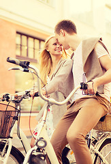 Image showing couple with bicycles in the city