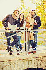 Image showing couples with tourist map in autumn park