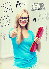 Image showing smiling student with folders