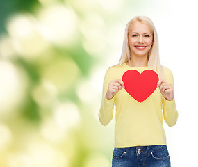 Image showing smiling woman with red heart