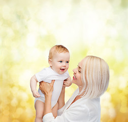 Image showing happy mother with smiling baby