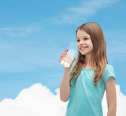 Image showing smiling little girl with glass of water