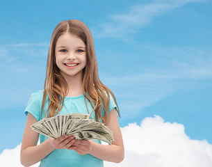 Image showing smiling little girl with dollar cash money