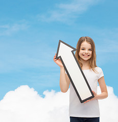 Image showing smiling little girl with blank arrow pointing up