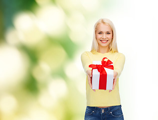 Image showing smiling girl with gift box