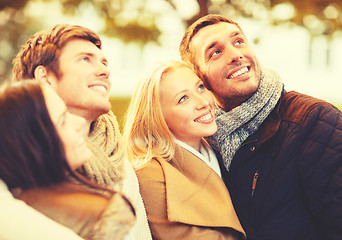 Image showing group of friends having fun in autumn park