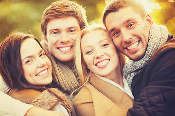 Image showing group of friends having fun in autumn park