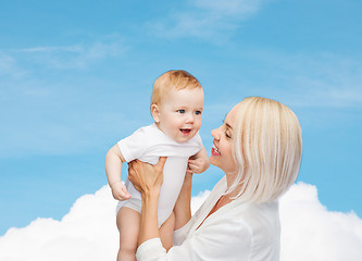 Image showing happy mother with smiling baby