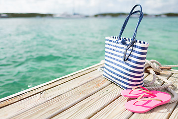 Image showing close up of beach accessories on wooden pier