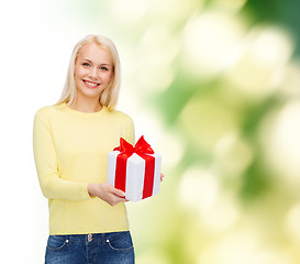 Image showing smiling girl with gift box