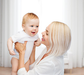 Image showing happy mother with smiling baby