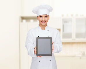 Image showing smiling female chef with tablet pc blank screen