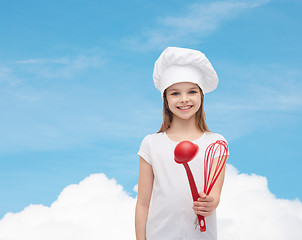 Image showing smiling girl in cook hat with ladle and whisk