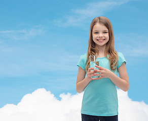 Image showing smiling little girl with glass of water