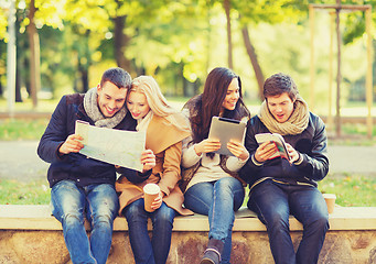 Image showing couples with tourist map in autumn park