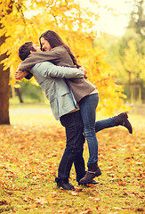 Image showing romantic couple playing in the autumn park