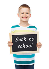 Image showing smiling little boy holding chalkboard