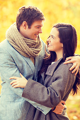 Image showing romantic couple kissing in the autumn park