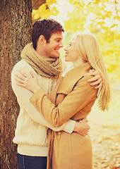 Image showing romantic couple kissing in the autumn park