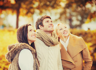 Image showing group of friends having fun in autumn park