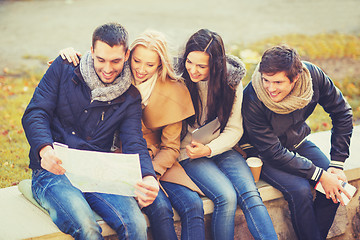 Image showing couples with tourist map in autumn park