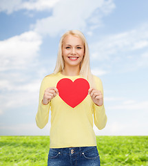 Image showing smiling woman with red heart