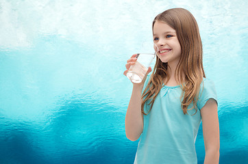 Image showing smiling little girl with glass of water