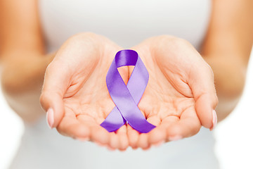 Image showing hands holding purple awareness ribbon