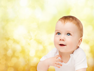 Image showing smiling baby looking up