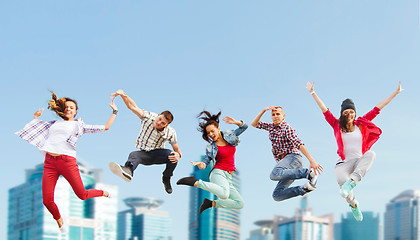 Image showing group of teenagers jumping