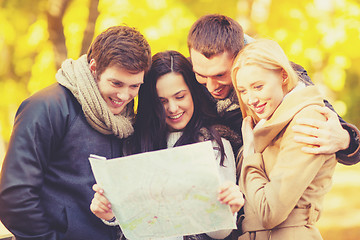 Image showing couples with tourist map in autumn park