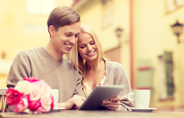 Image showing couple with tablet pc in cafe