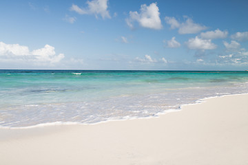 Image showing blue sea or ocean, white sand and sky with clouds