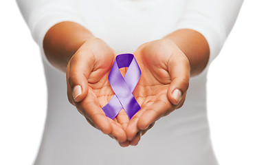 Image showing hands holding purple awareness ribbon