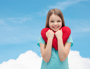 Image showing smiling little girl with red heart