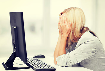 Image showing stressed woman with computer