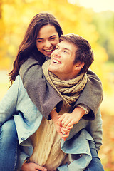 Image showing romantic couple playing in the autumn park