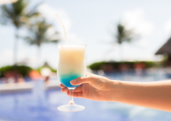 Image showing close-up of hand holding glass with cocktail