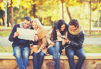 Image showing couples with tourist map in autumn park