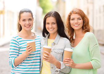 Image showing smiling teenage girls with on street
