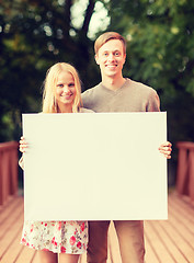 Image showing romantic couple with blank white board